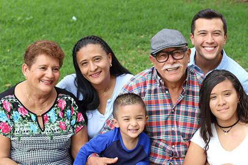 Smiling multi-generational family outdoors